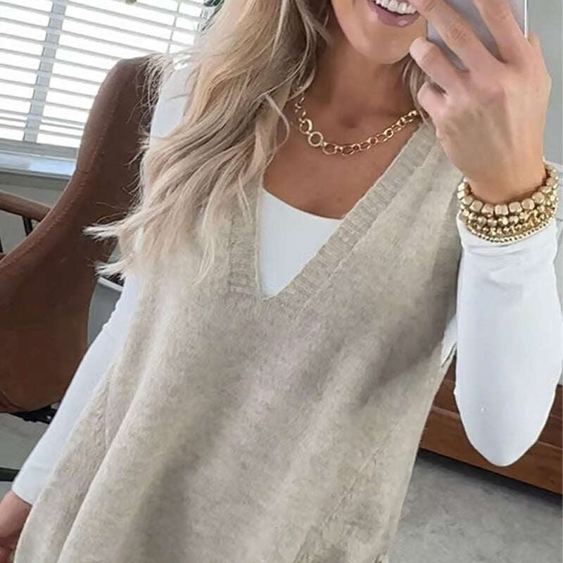 Colete feminino solto de gola alta com bolsos