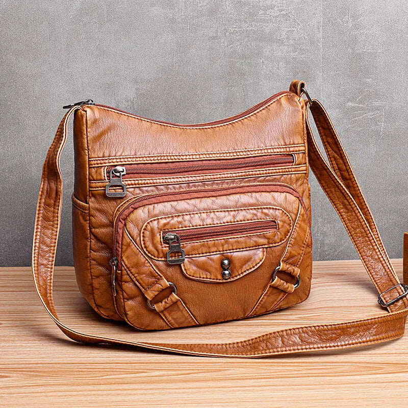 Bolsa de ombro feminina feita de couro macio