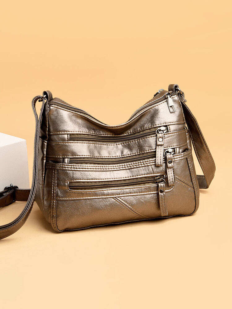 Bolsa de ombro feminina em couro PU com vários bolsos antirroubo