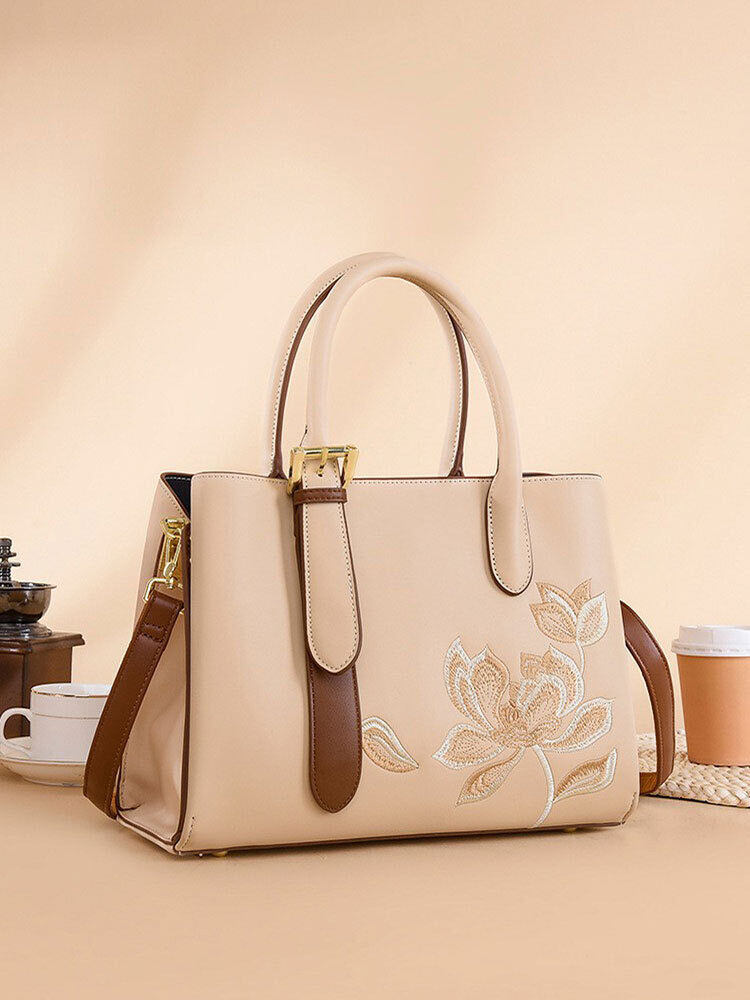 Új kézitáska: hímzett stílusú, mindennapi utazáshoz alkalmas.