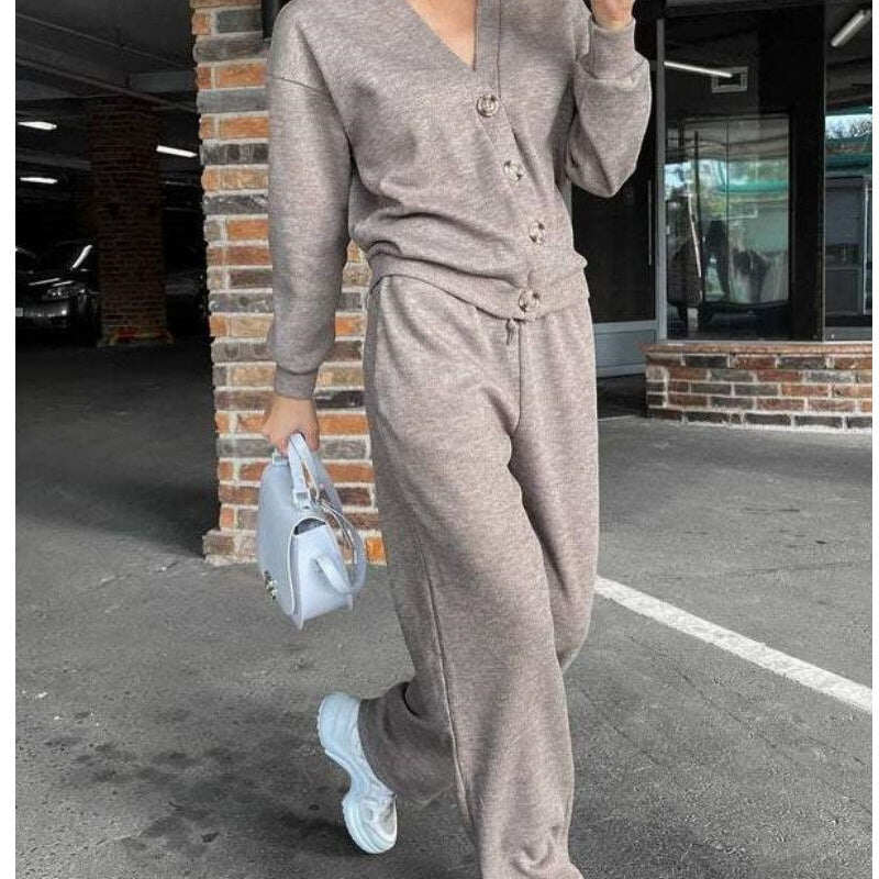 Conjunto feminino de duas peças de jaqueta e calça de malha com botões