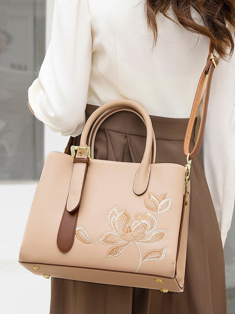 Új kézitáska: hímzett stílusú, mindennapi utazáshoz alkalmas.