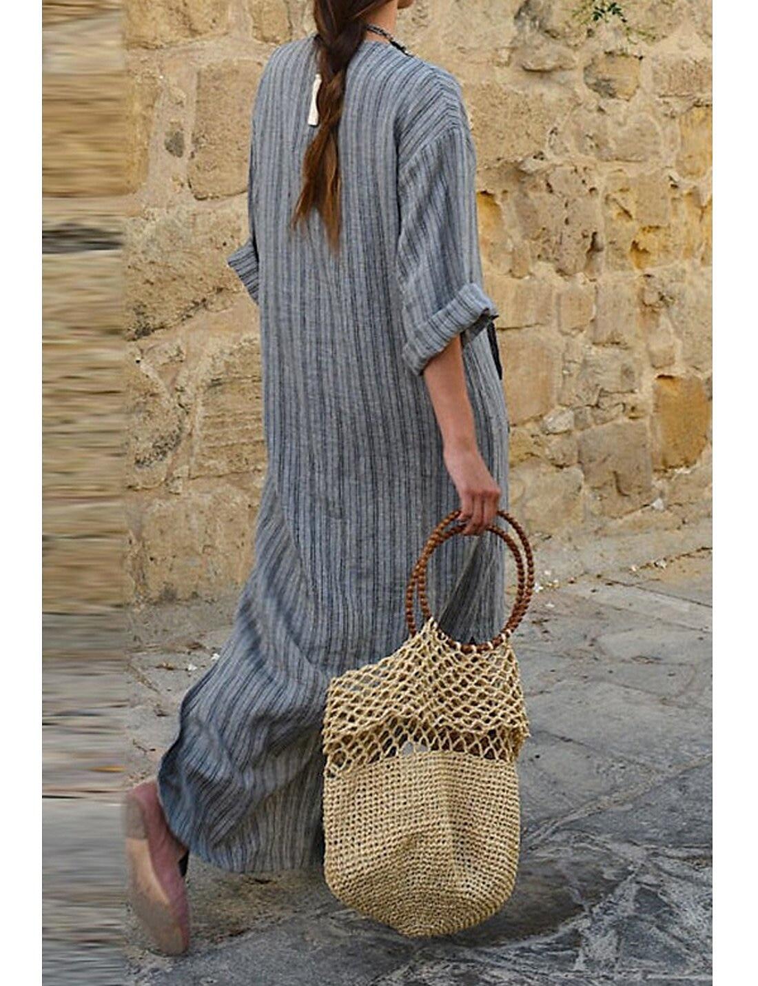 Vestido comprido de mulher com mangas curtas e bainha irregular