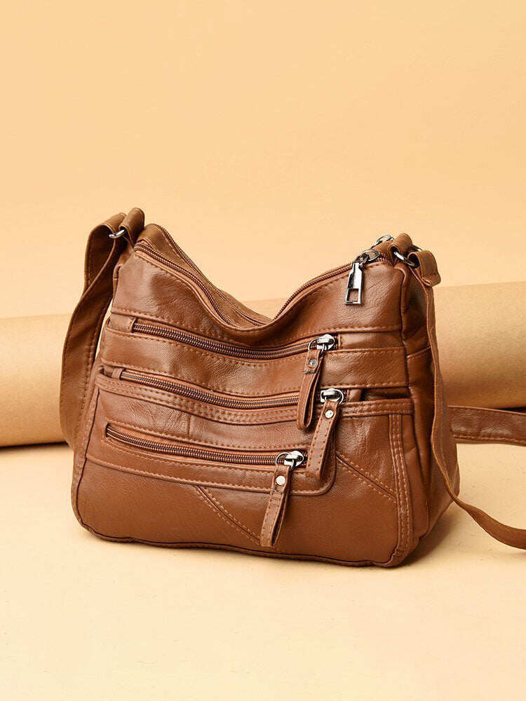 Bolsa de ombro feminina em couro PU com vários bolsos antirroubo