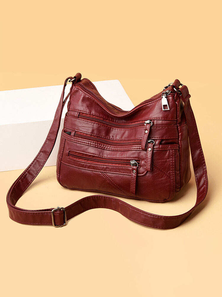 Bolsa de ombro feminina em couro PU com vários bolsos antirroubo